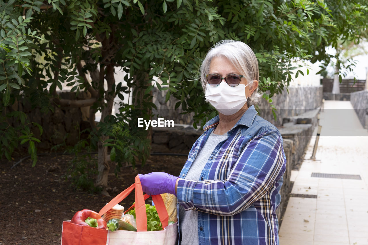 Woman with shopping bag outdoors