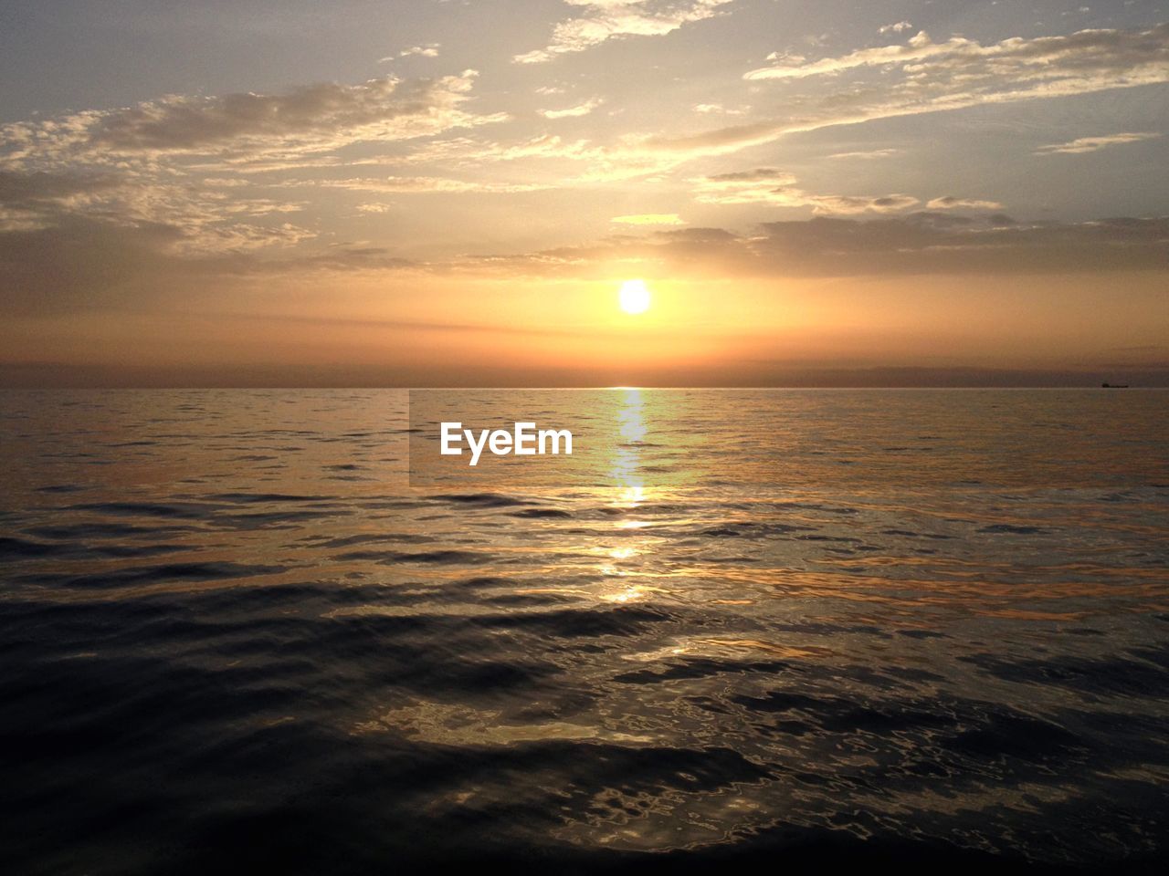 Idyllic shot of sea against sunset sky