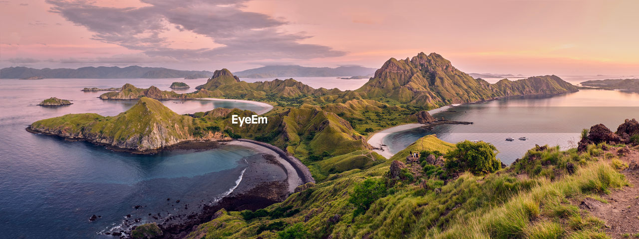 Panoramic view of sea and mountains against sky