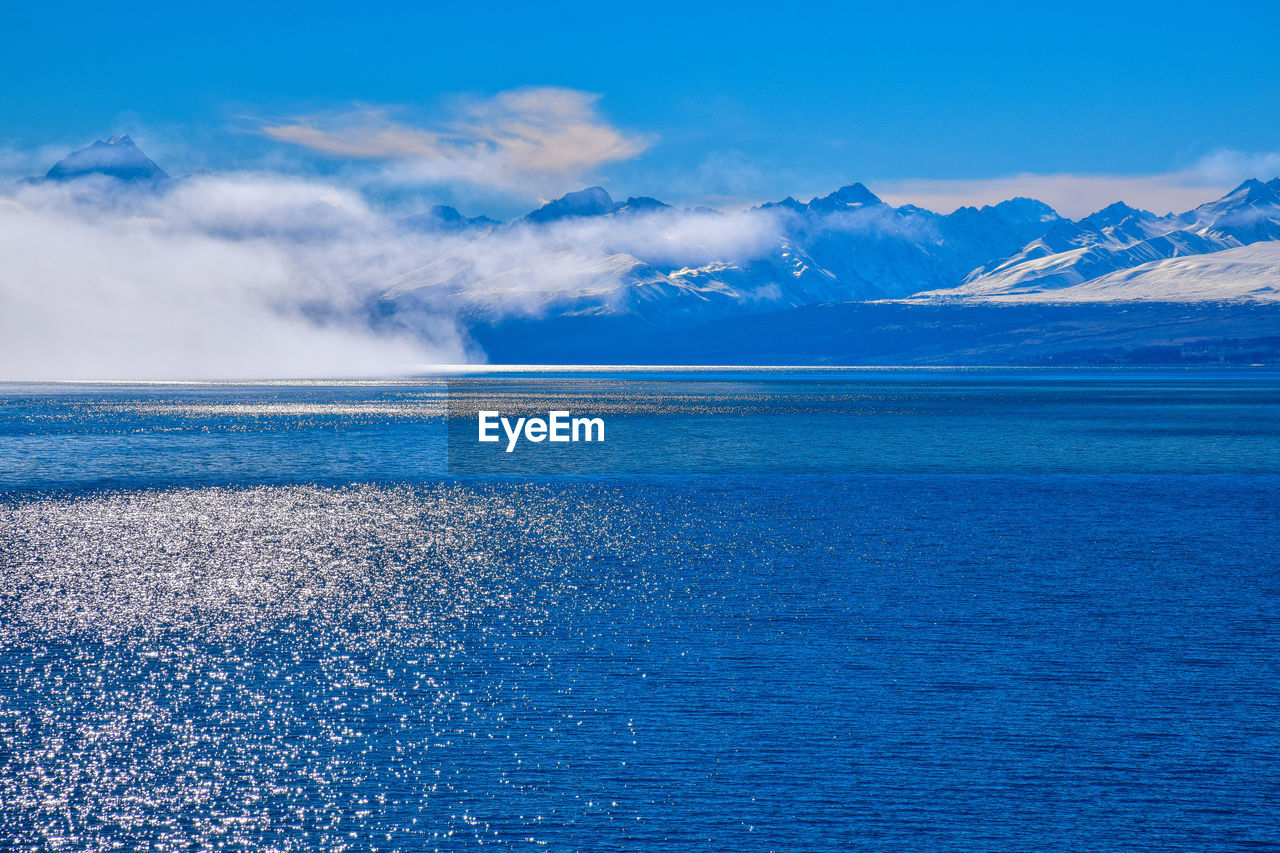 Scenic view of sea against blue sky