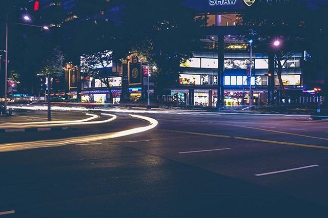 ILLUMINATED CITY STREET AT NIGHT