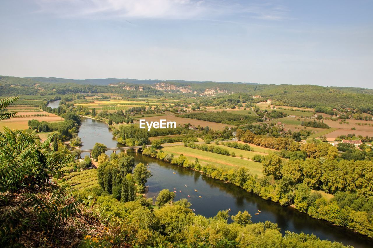 Scenic view of river amidst landscape against sky