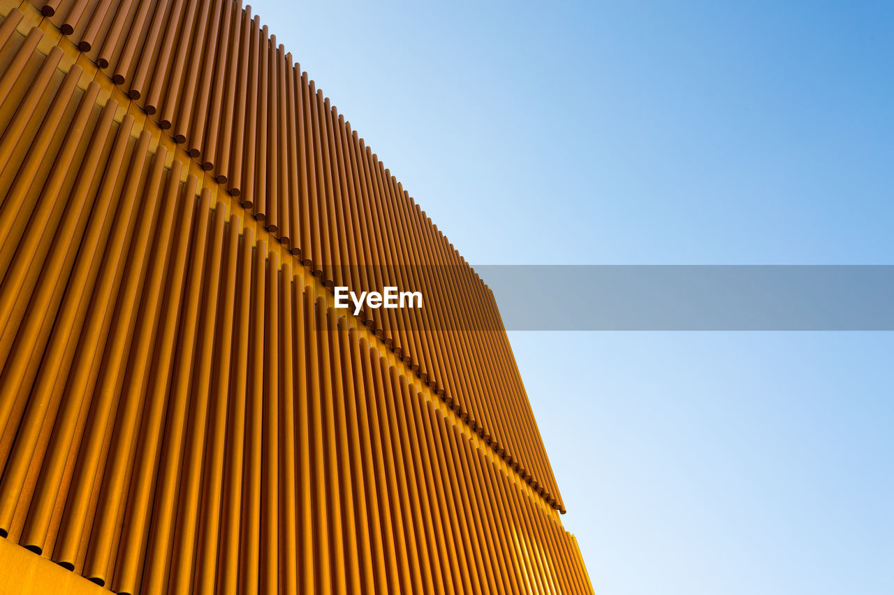 Low angle view of modern building against clear sky