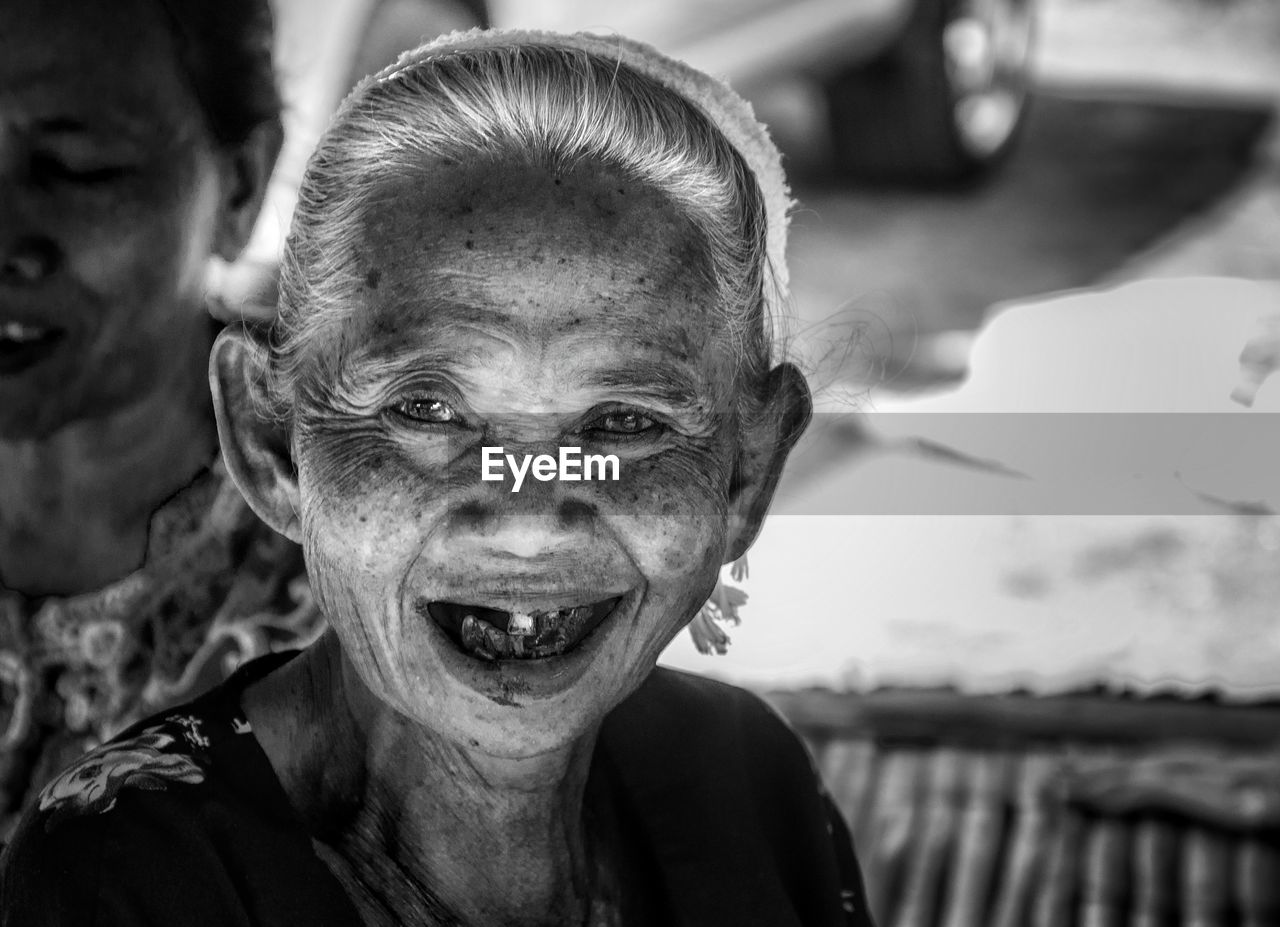 Close-up portrait of smiling senior woman