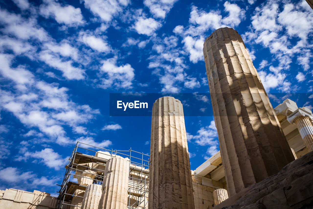 Low angle view of parthenon against blue sky