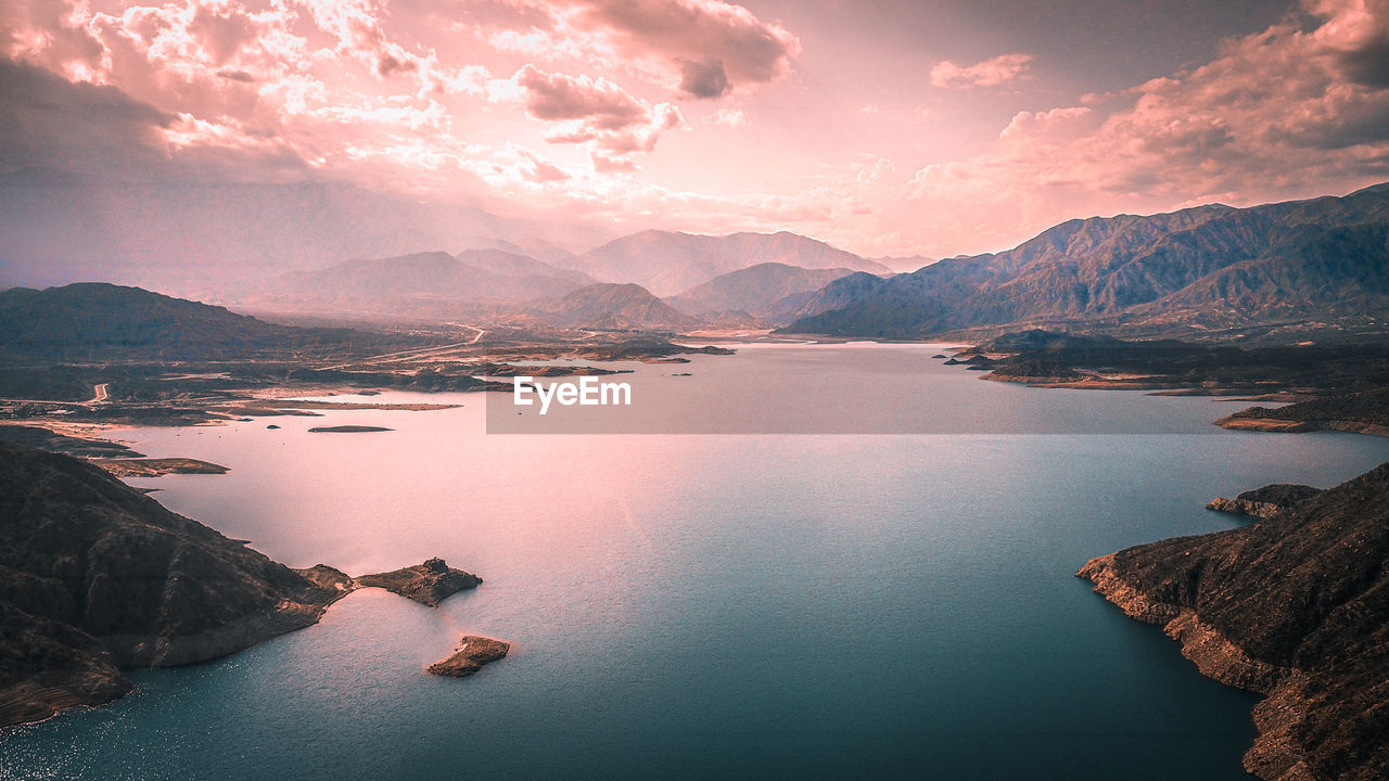 Aerial view of lake against sky during sunset