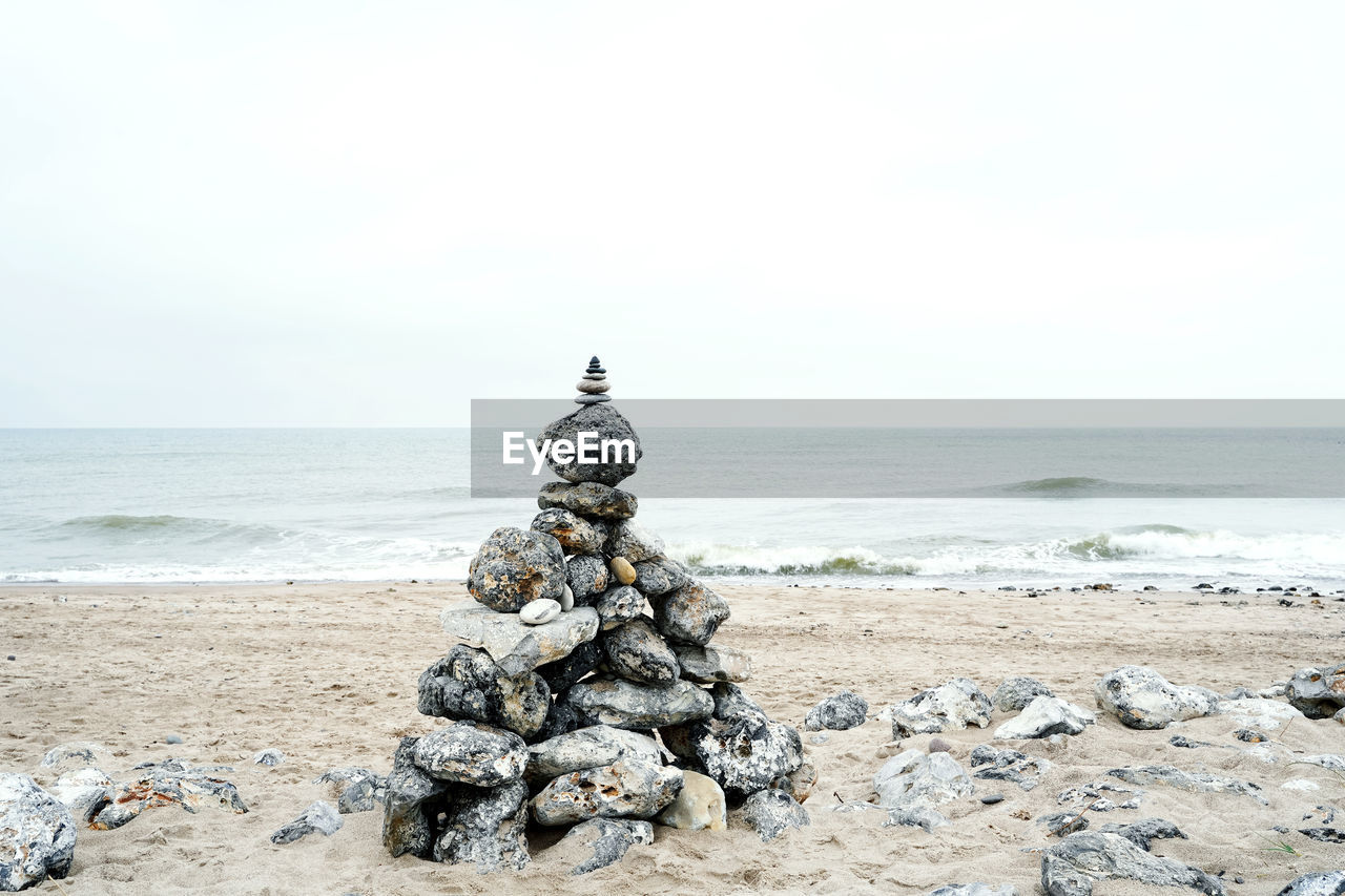 STACK OF STONES ON BEACH