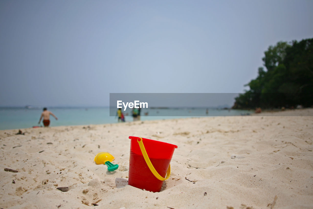 CLOSE-UP OF BEACH UMBRELLA ON SHORE