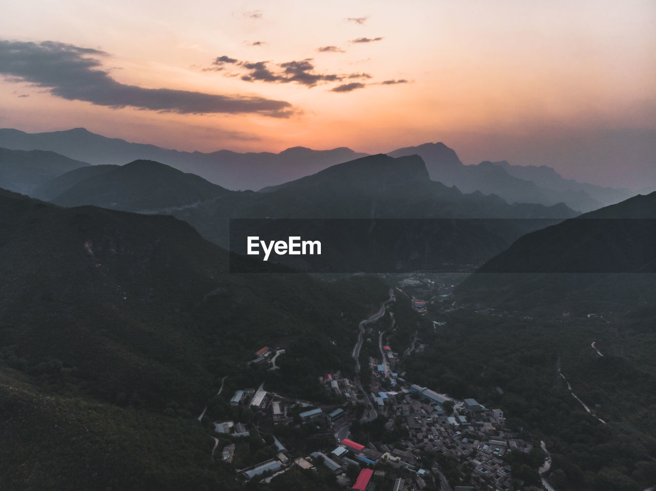 High angle view of mountains against sky during sunset