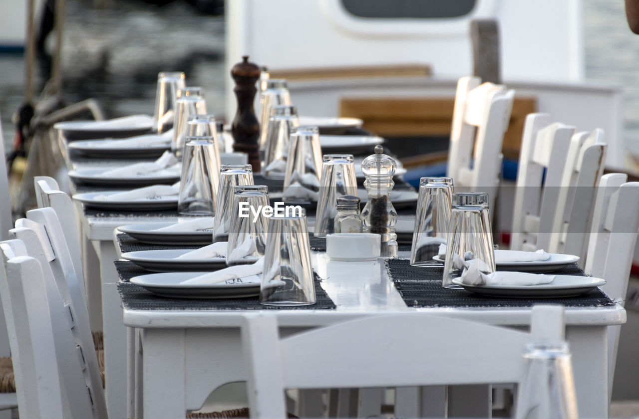 Empty chairs and tables in restaurant