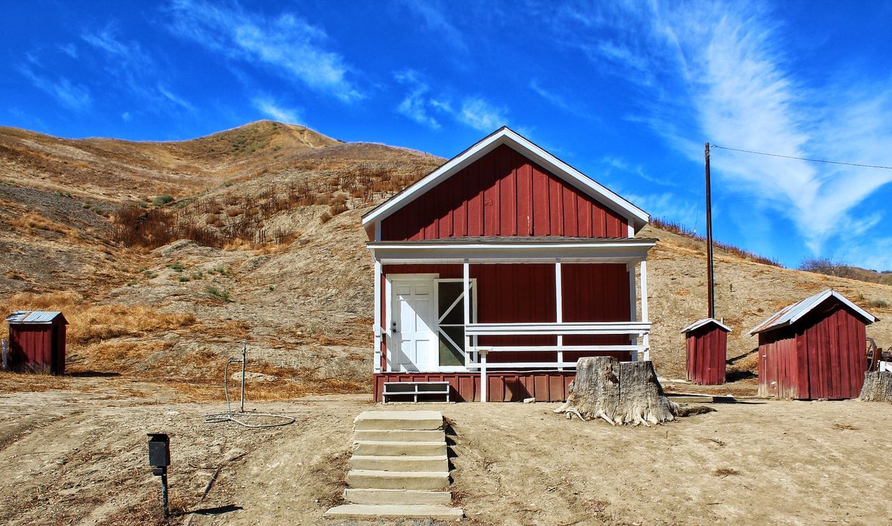 BEACH HUT AGAINST SKY