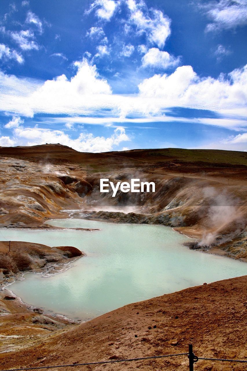 Scenic view of volcanic landscape against sky at namafjall, iceland.