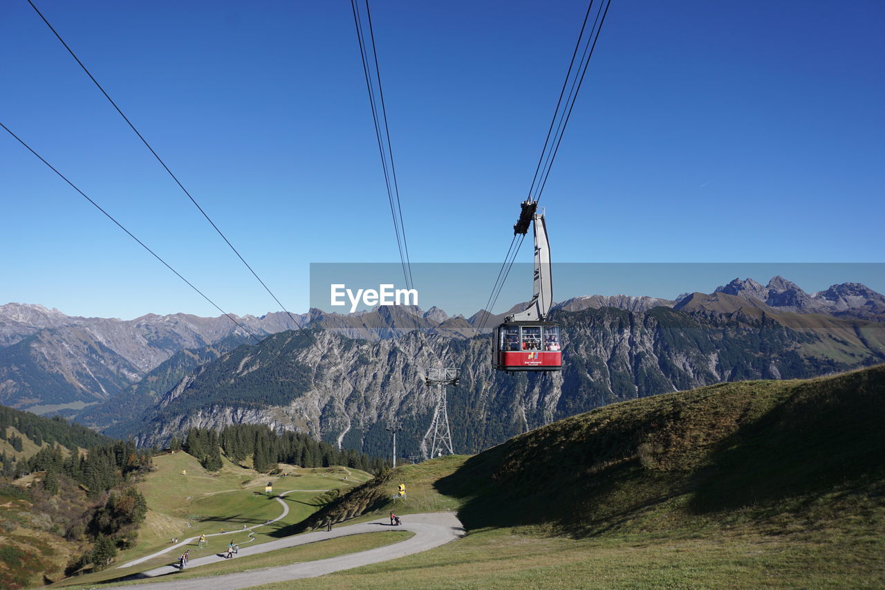 OVERHEAD CABLE CARS AGAINST SKY