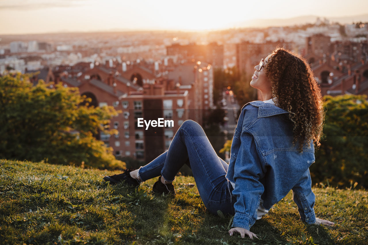 Young woman spending leisure time in park