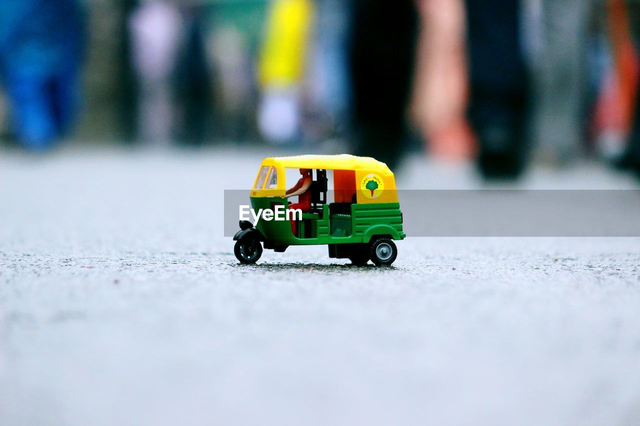CLOSE-UP OF TOY CAR IN PARK