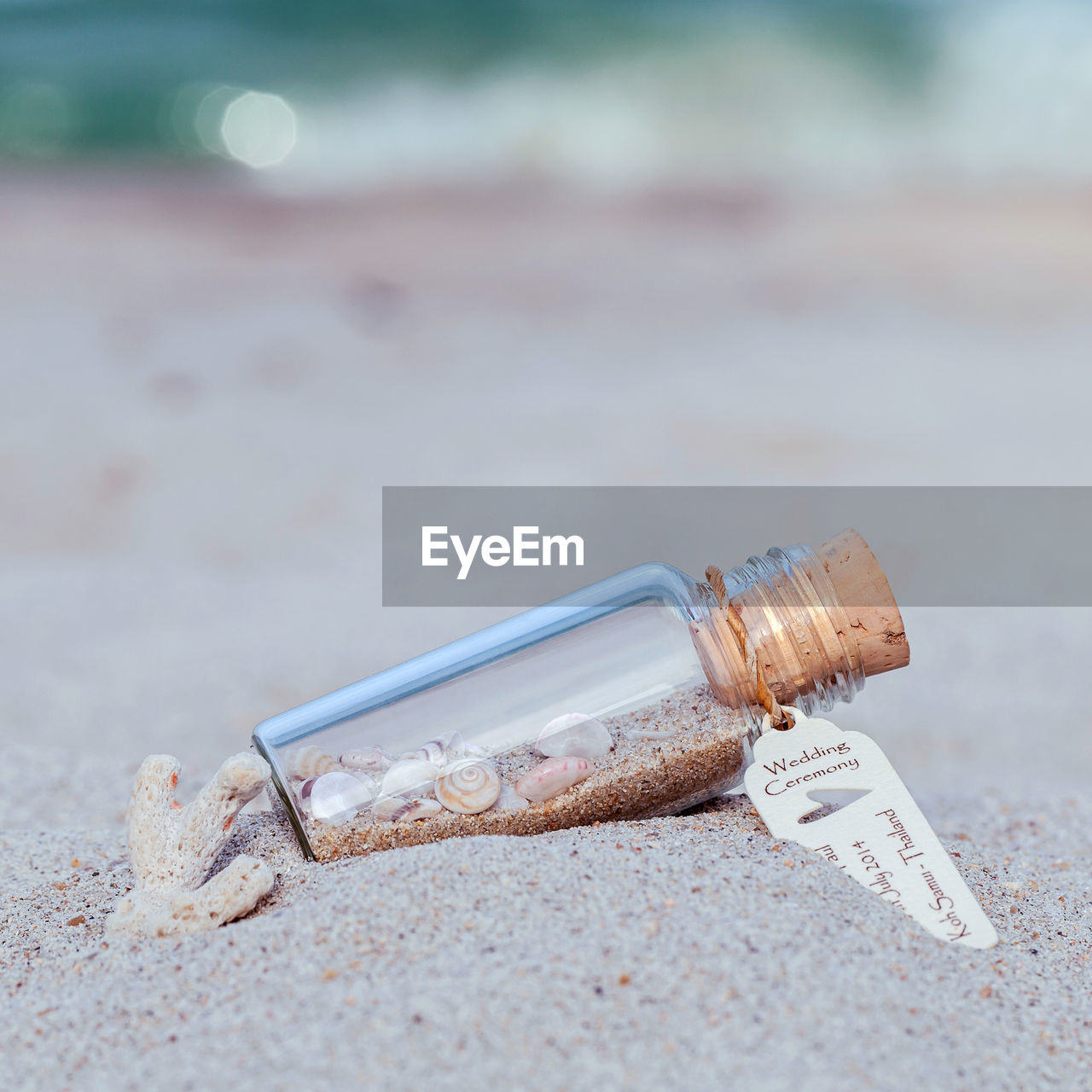 Close up of bottle on sand