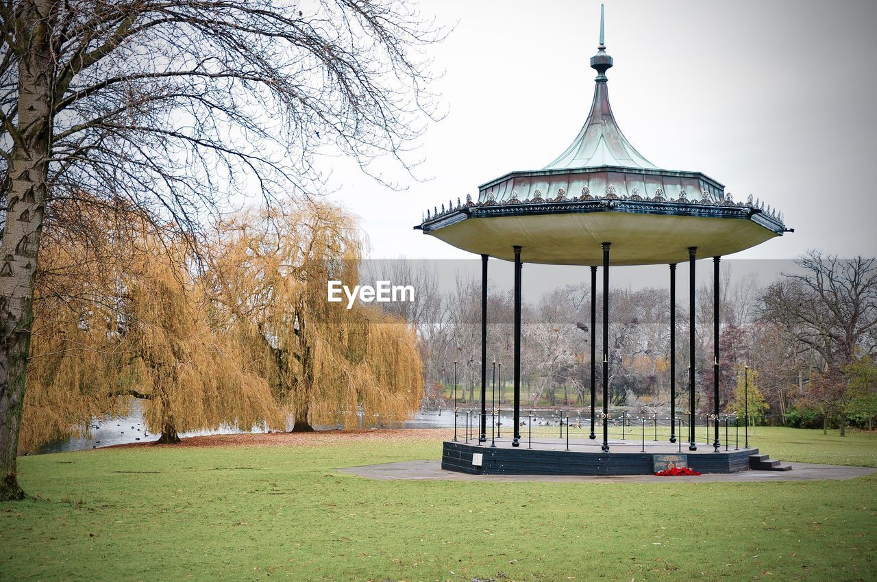 Empty gazebo at park against sky