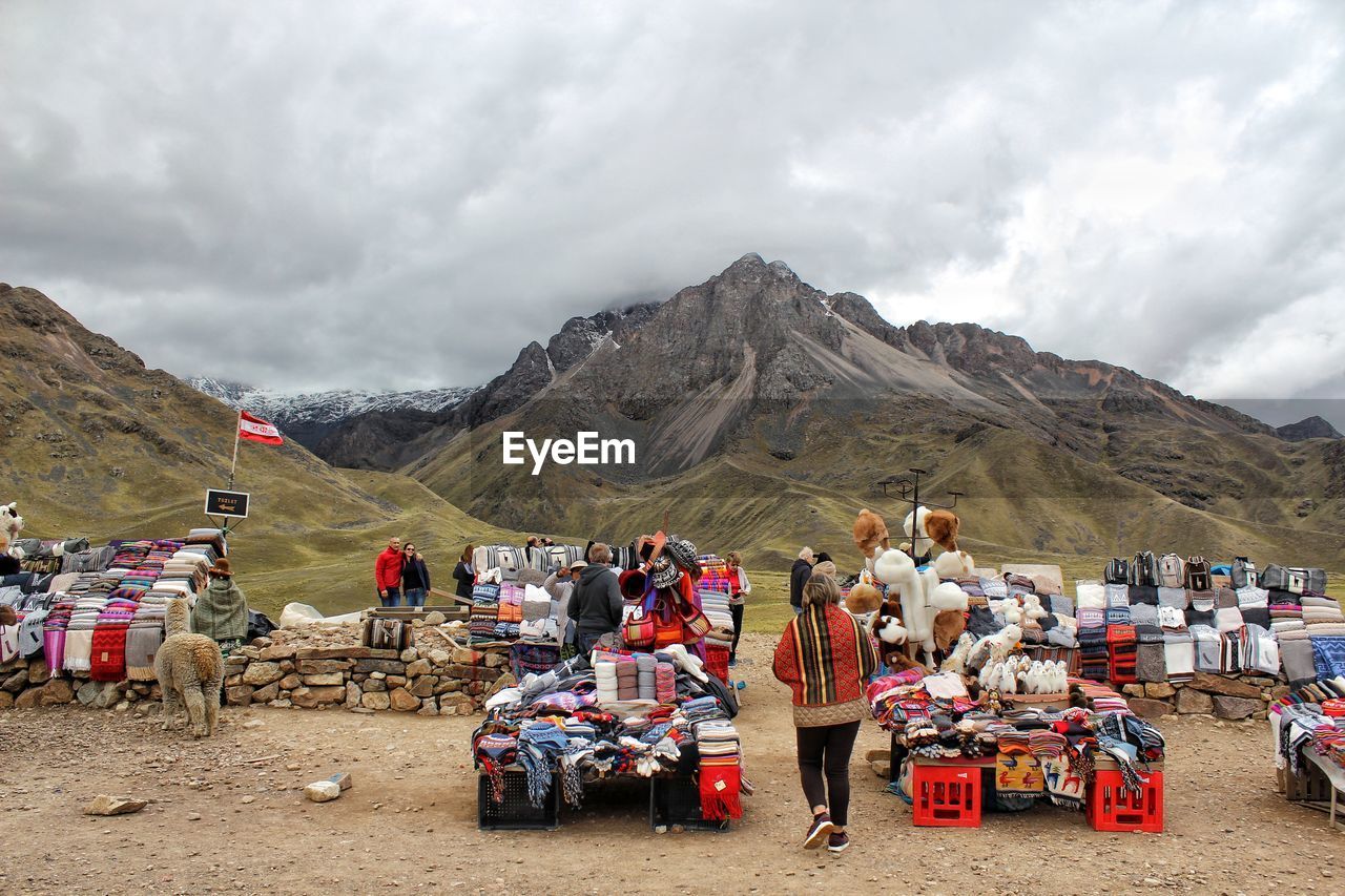 GROUP OF PEOPLE ON MOUNTAIN ROAD