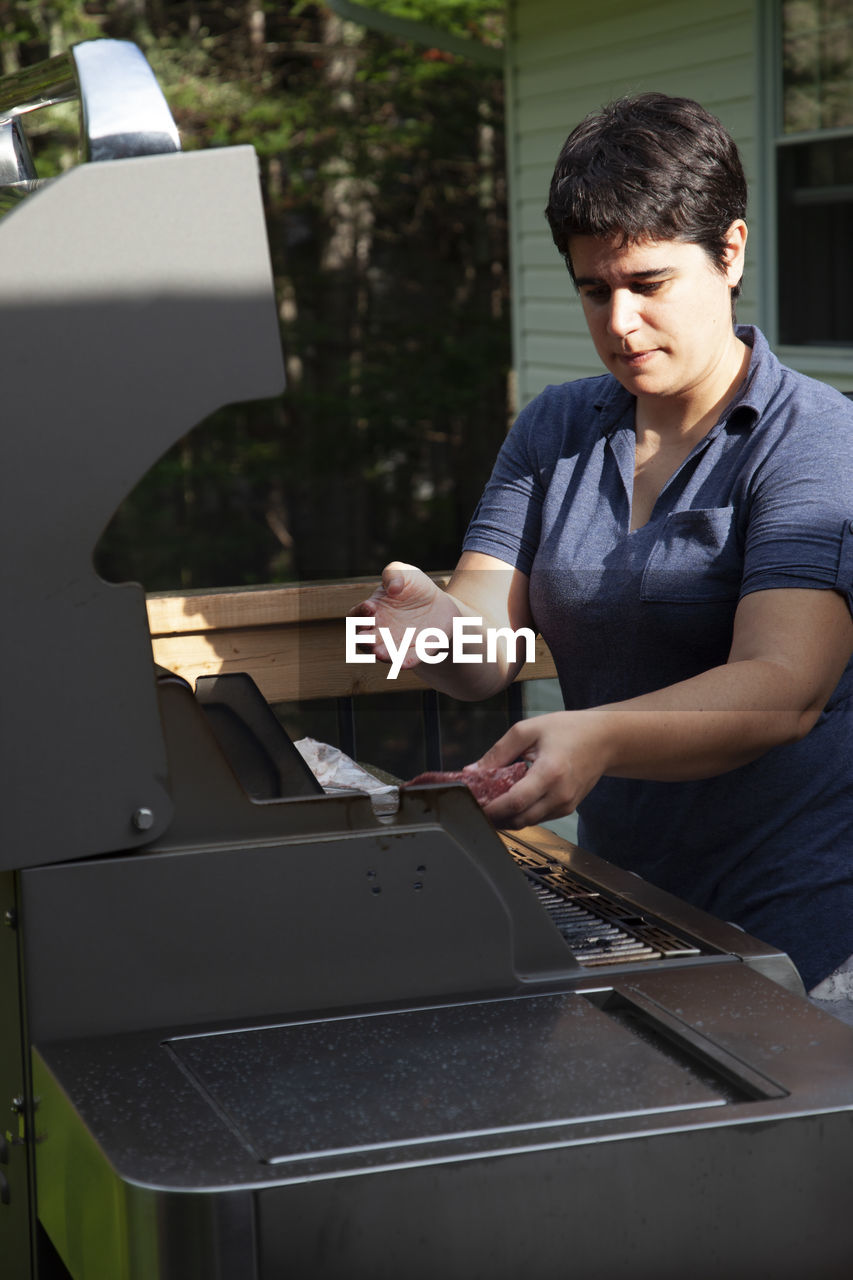 Mid adult man working in machine