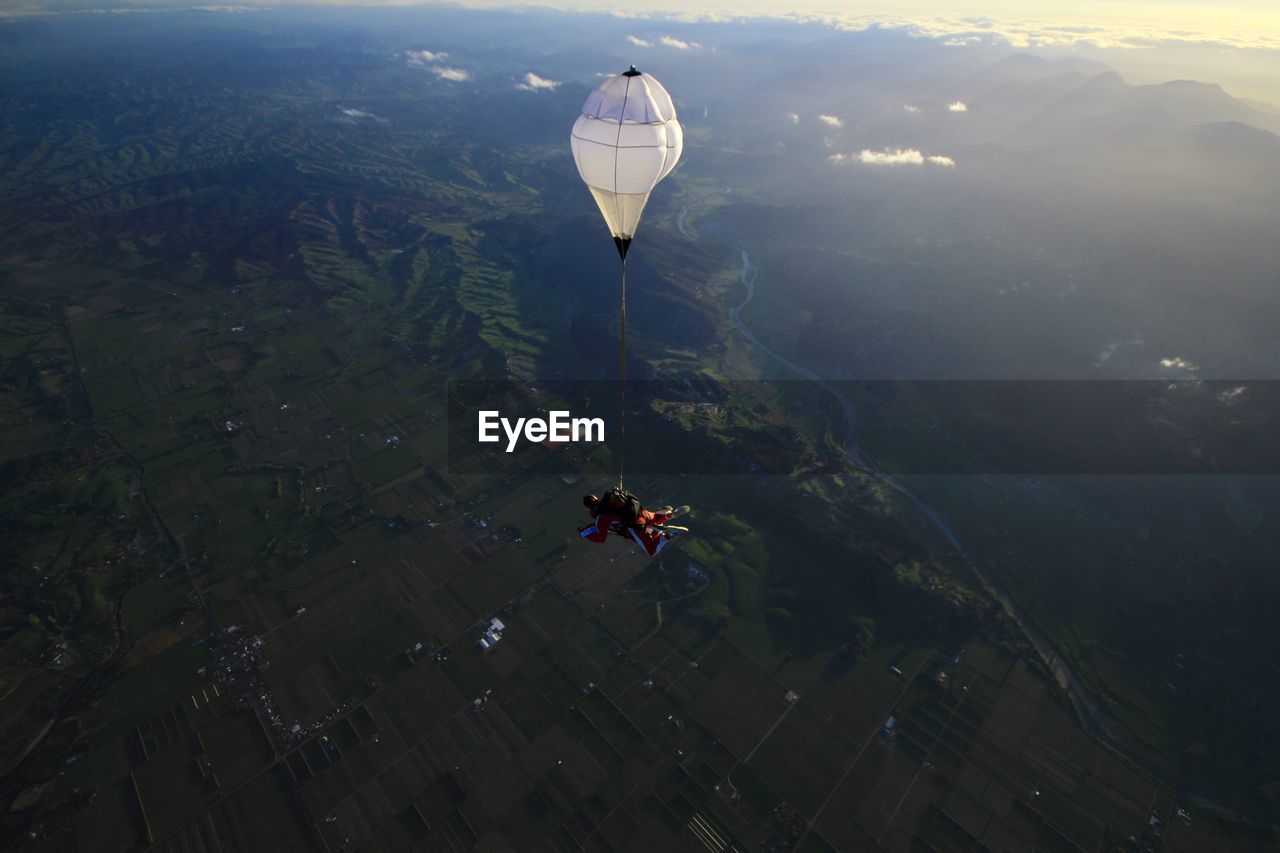 High angle view of man paragliding in mid-air