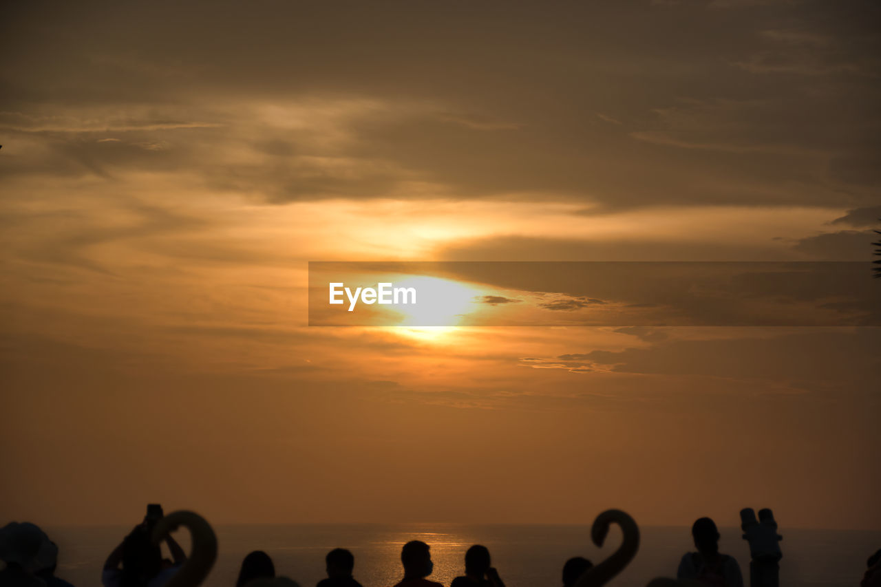 SILHOUETTE PEOPLE AGAINST SKY DURING SUNSET