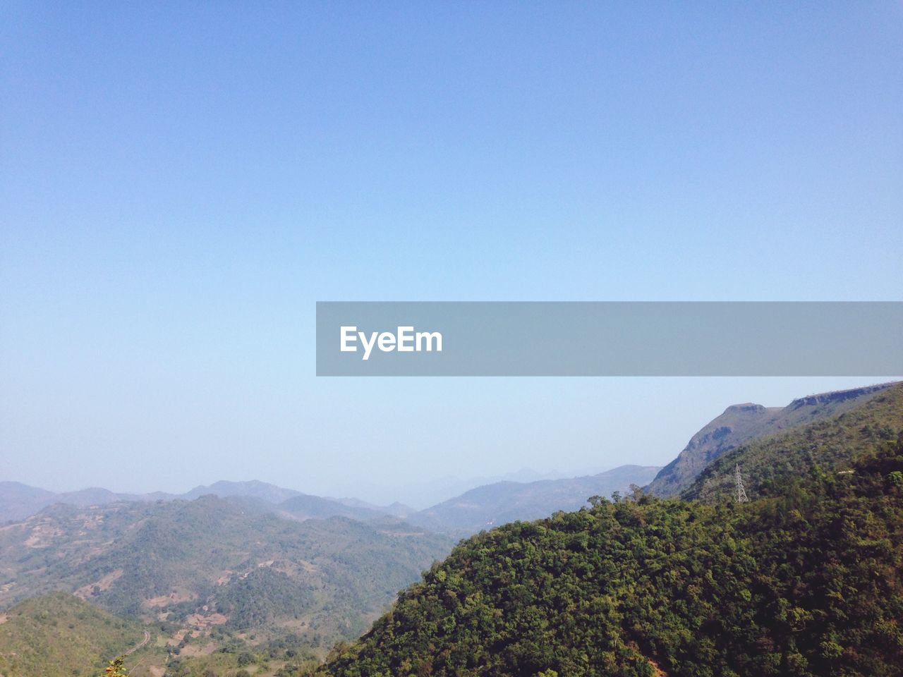 SCENIC VIEW OF MOUNTAINS AGAINST CLEAR SKY