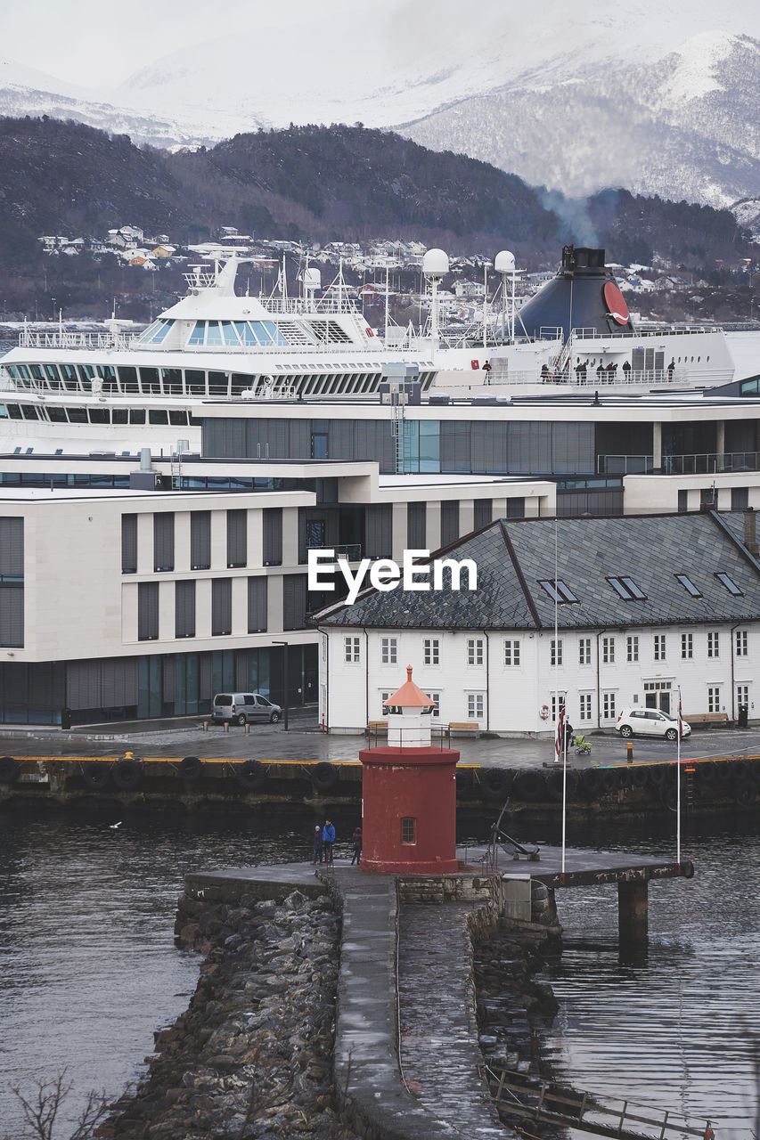 Mjolna lighthouse and cruise ship Ålesund, norway.