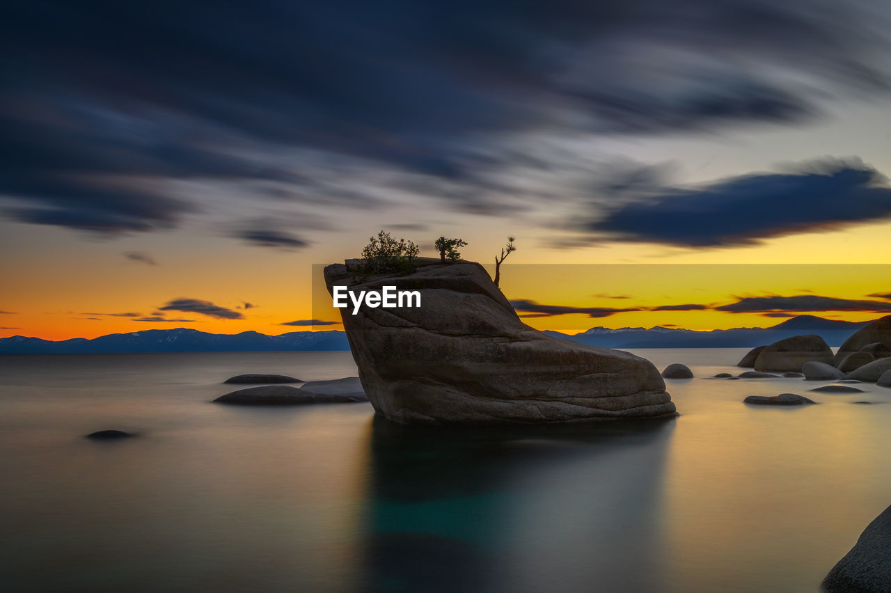 scenic view of sea against sky at sunset