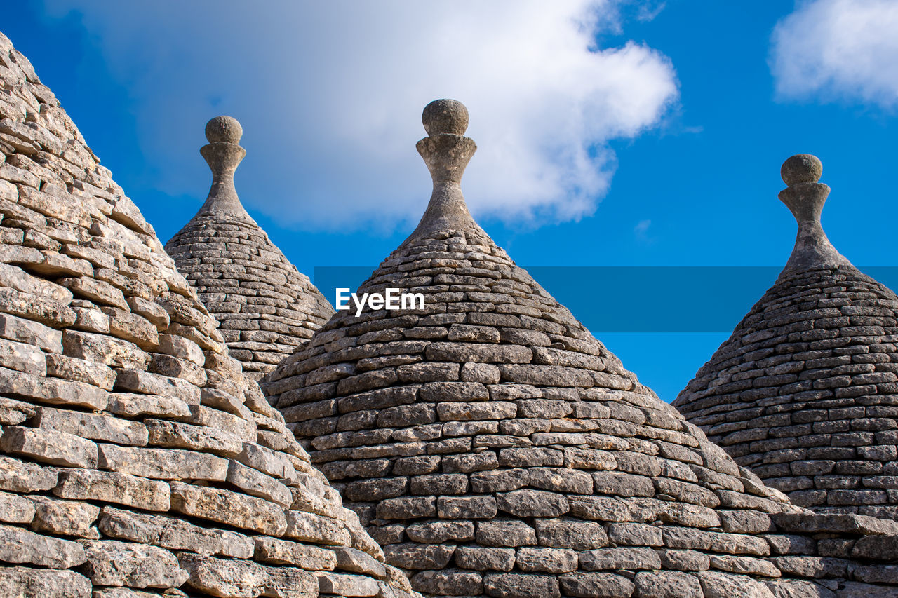 Traditional trulli or trullo house in puglia,, italy, europe, roof and blue sky
