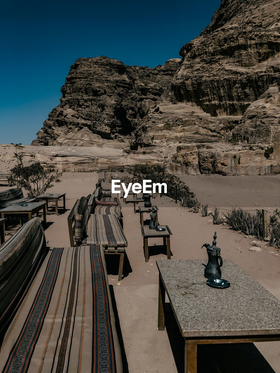 Aerial view of mountain range against blue sky