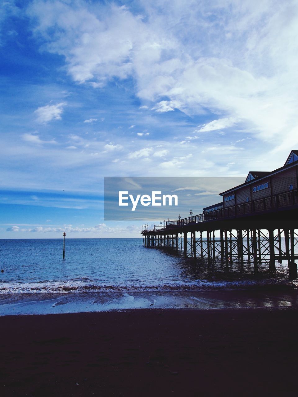 Pier over sea against sky