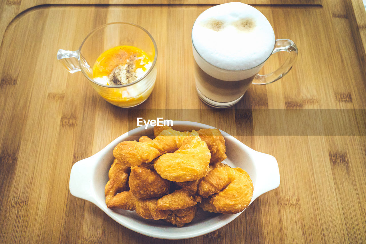 HIGH ANGLE VIEW OF BREAKFAST WITH COFFEE ON TABLE