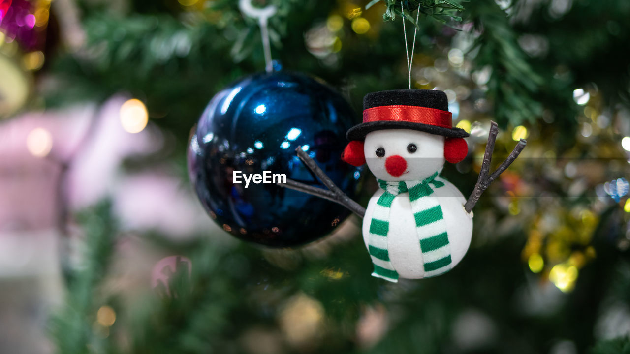 Close-up of christmas decoration hanging on tree