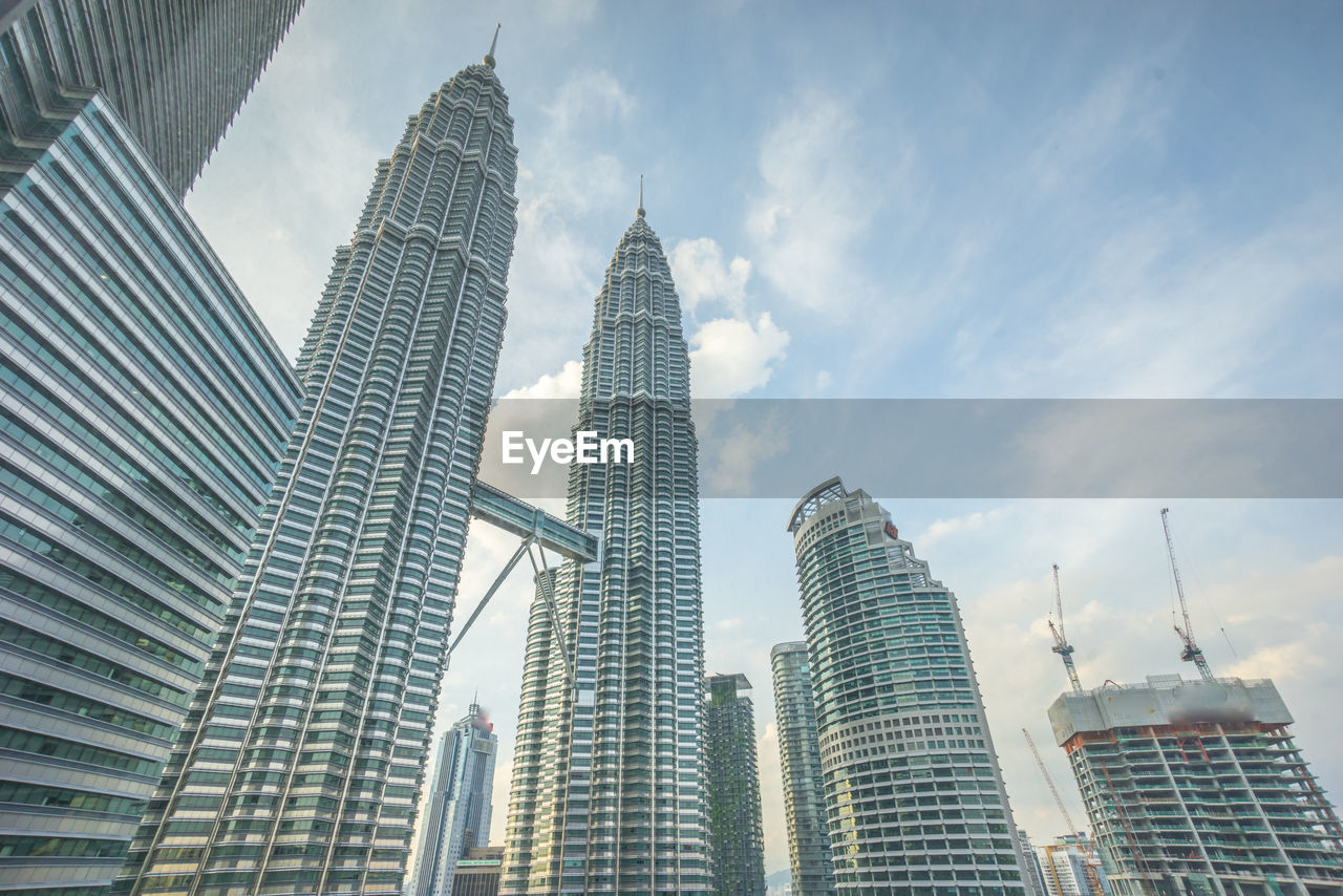 LOW ANGLE VIEW OF MODERN BUILDINGS AGAINST SKY