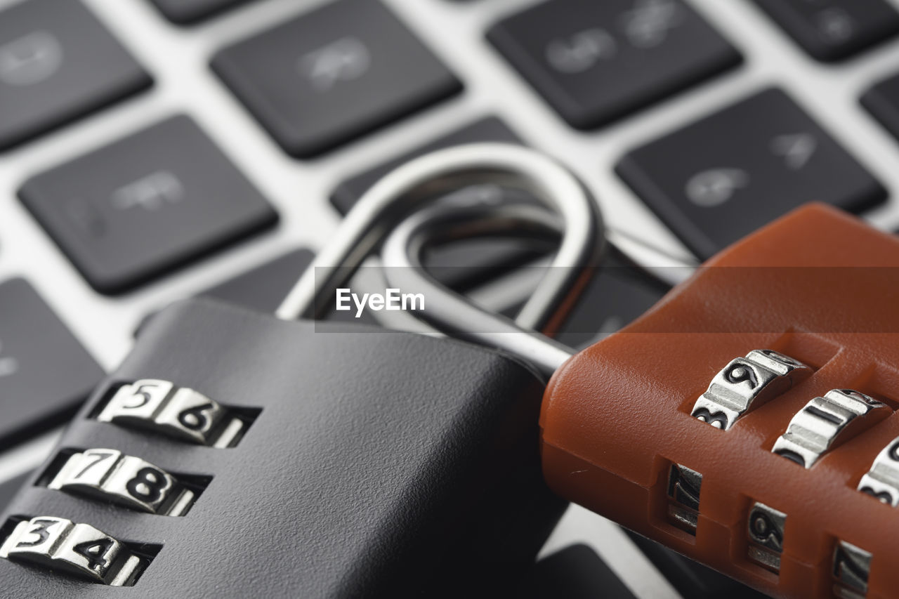 Close-up of padlocks on computer keyboard