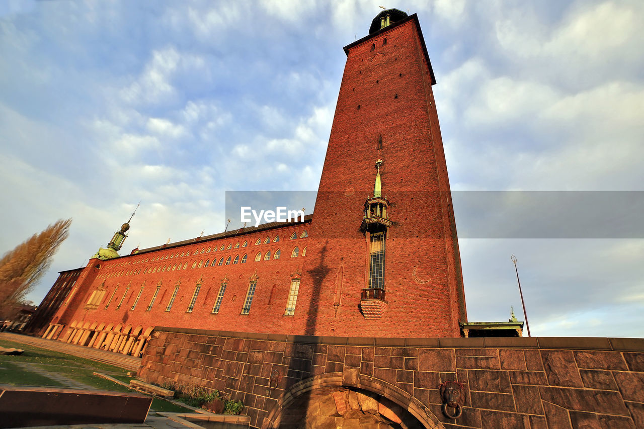 architecture, built structure, building exterior, sky, cloud, history, the past, landmark, building, tower, nature, place of worship, brick, travel destinations, no people, low angle view, wall, travel, religion, day, outdoors, city, brick wall, steeple, fort, belief