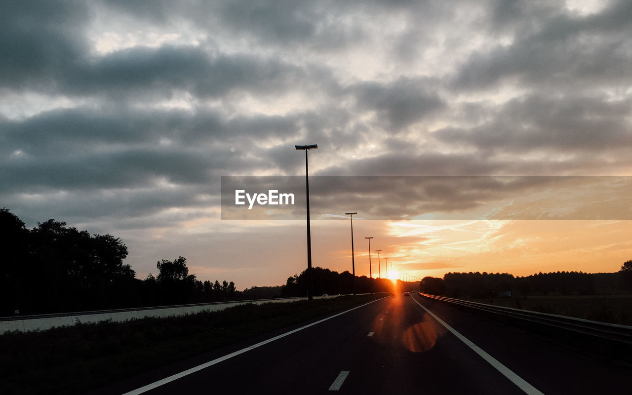 Road against sky during sunset