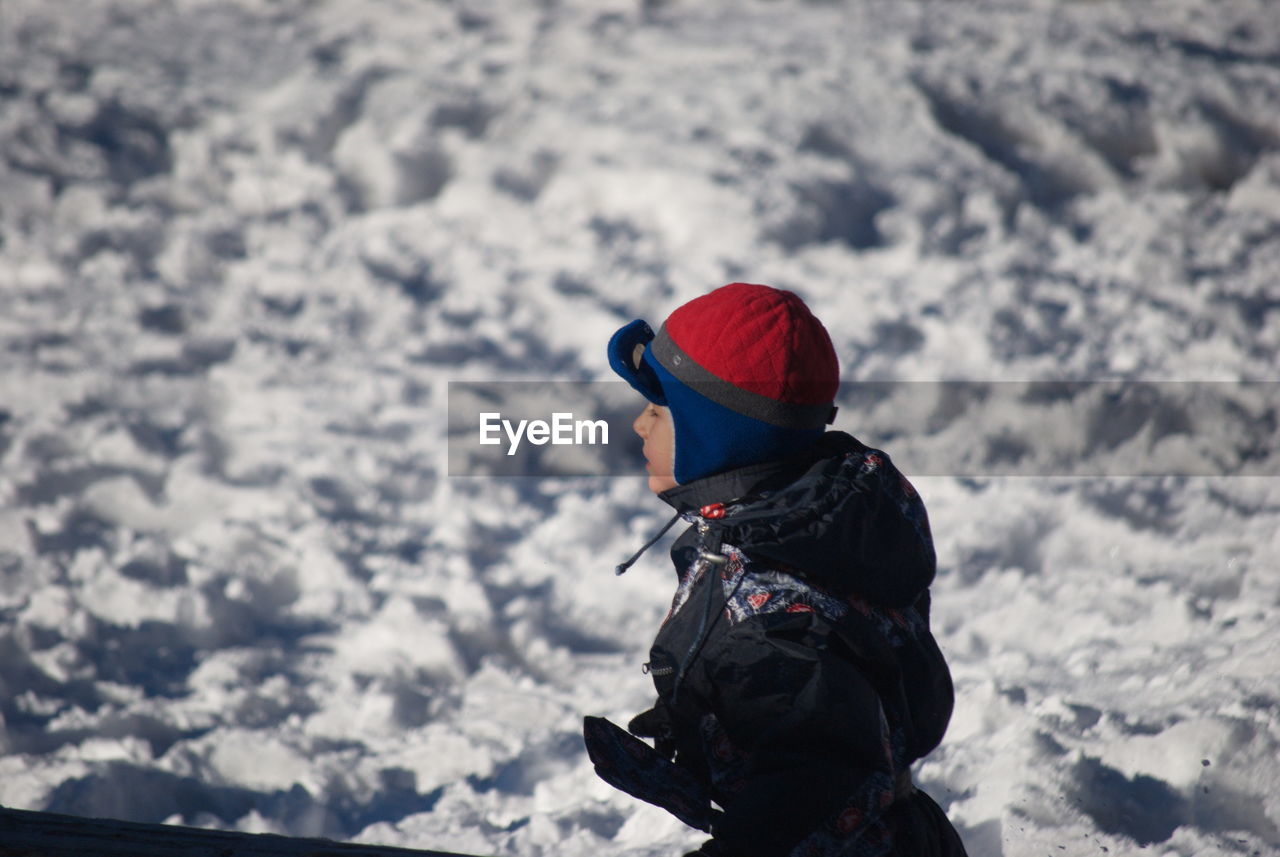 REAR VIEW OF CHILD IN SNOW