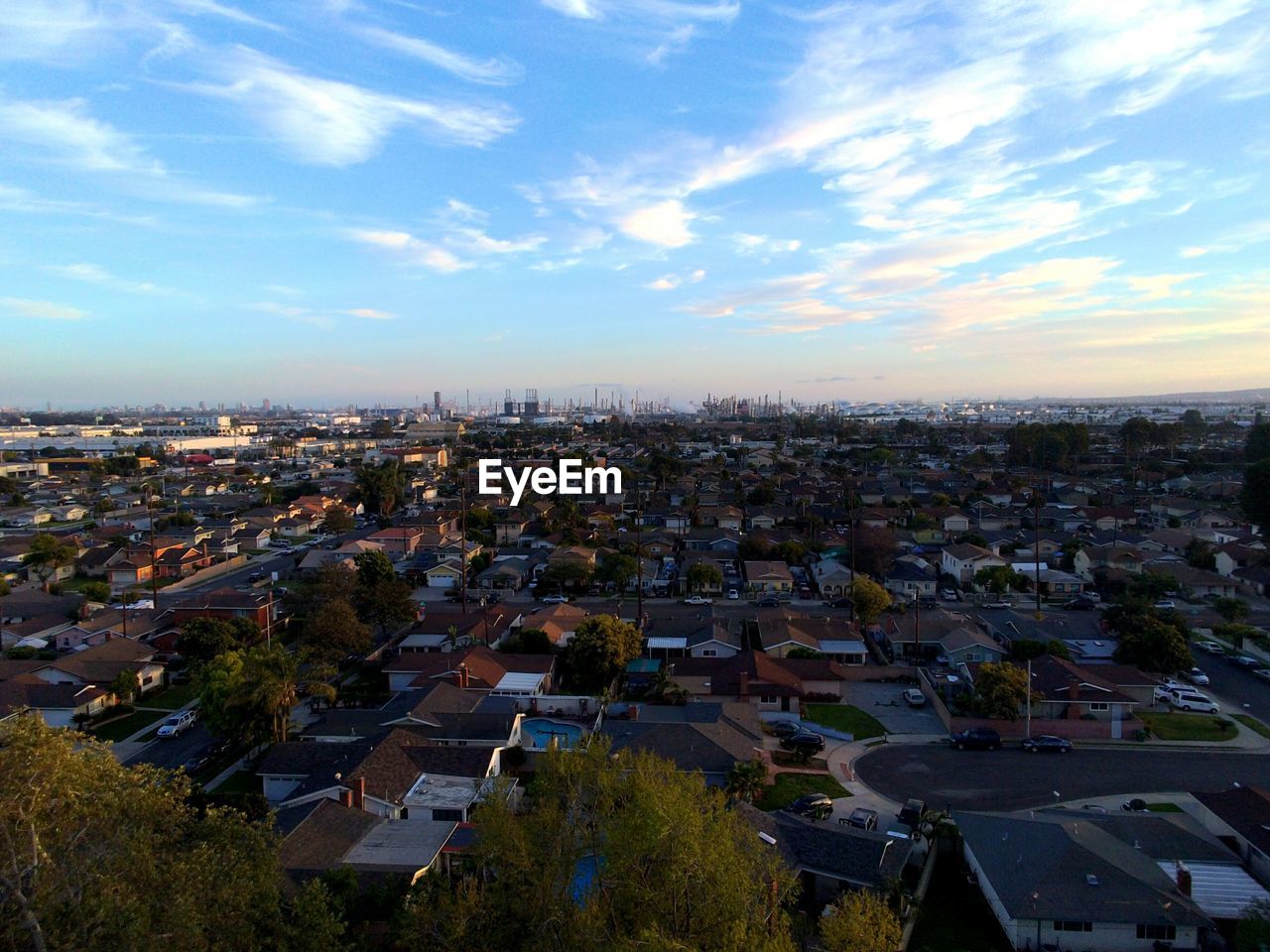 High angle view of cityscape against blue sky