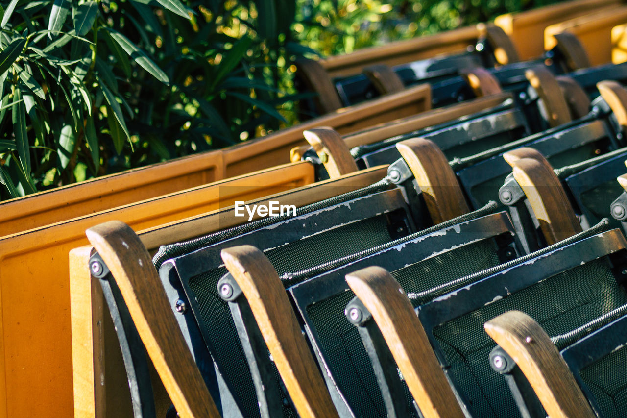 Close-up of chairs arranged outdoors