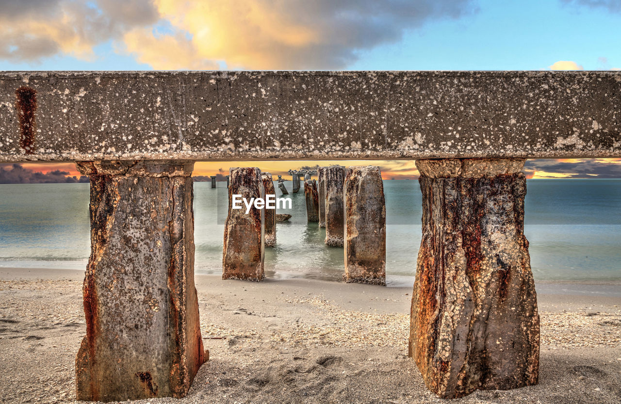 Sunset over old abandoned stone fishing pier called bocahenge is l shaped and found in boca grande 