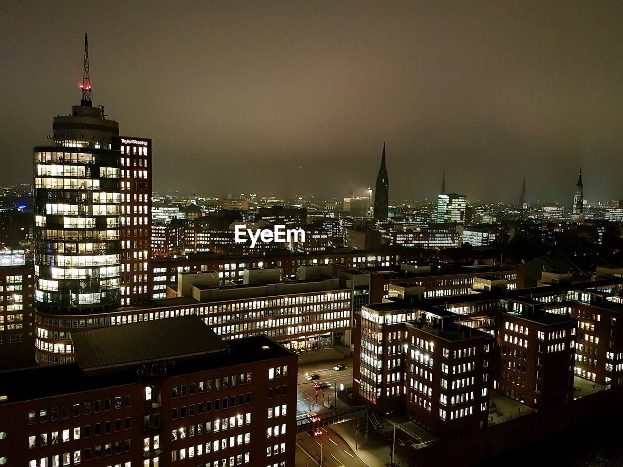 High angle view of city lit up at night