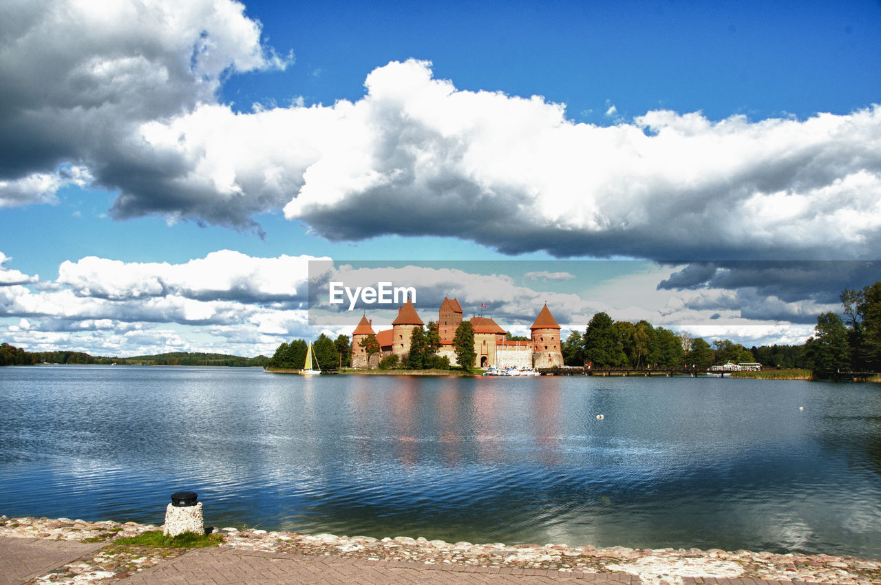 Fort by river against cloudy sky