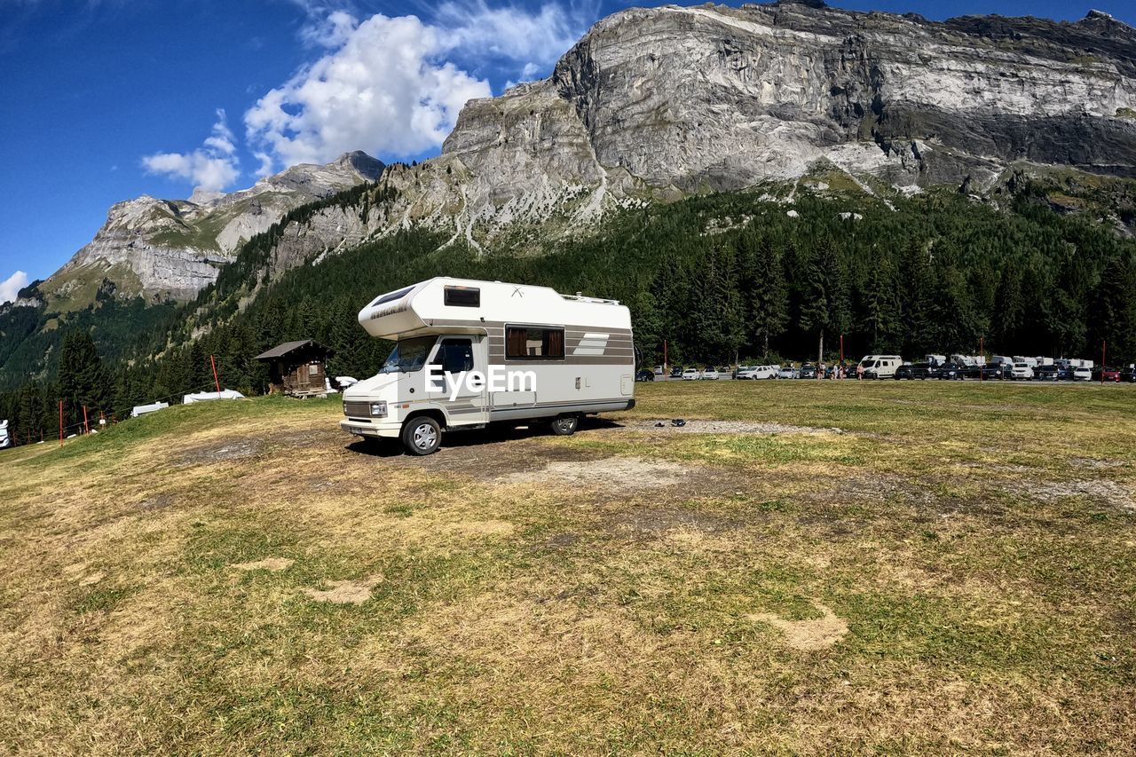 Scenic view of field against mountain