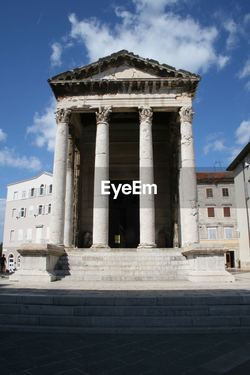 Low angle view of historic temple against sky