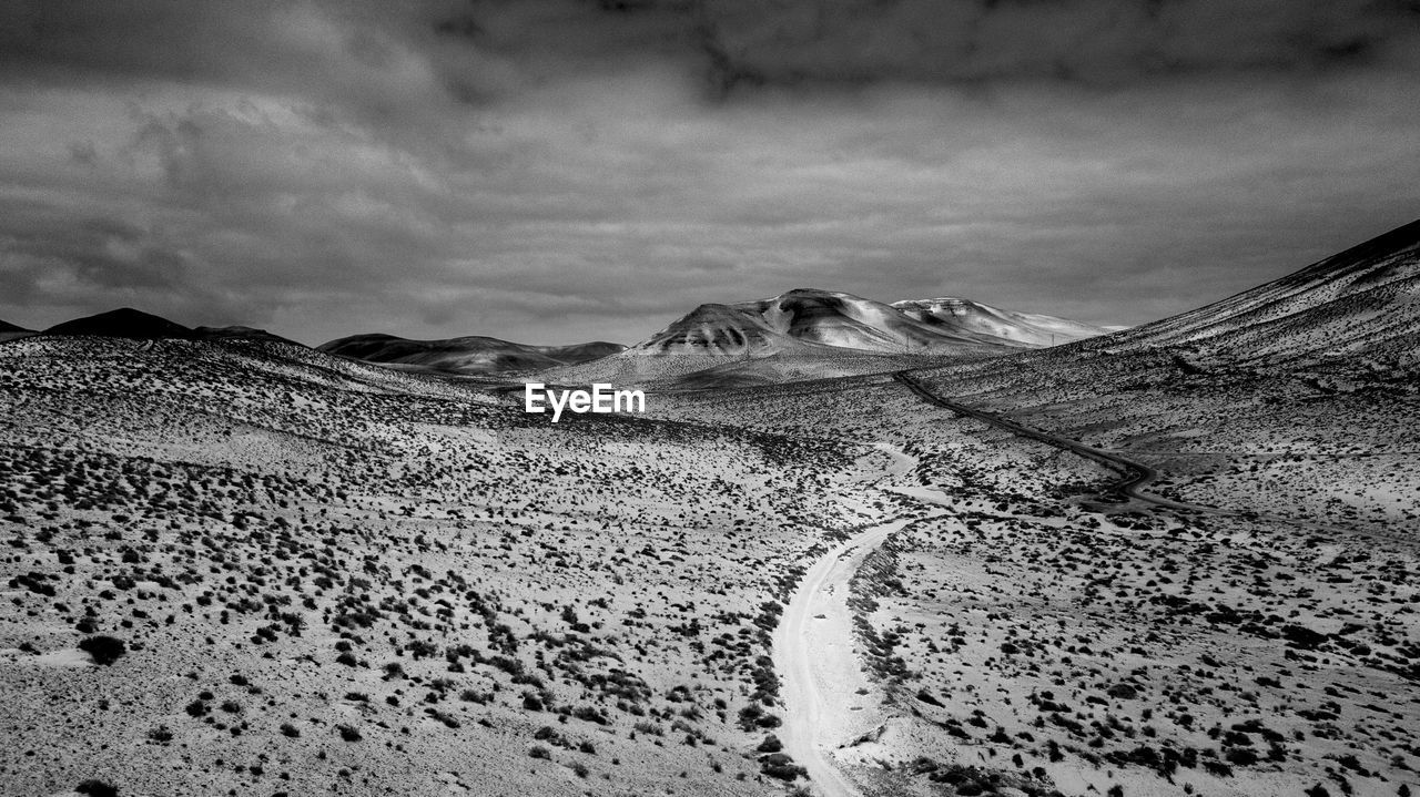 scenic view of desert against sky