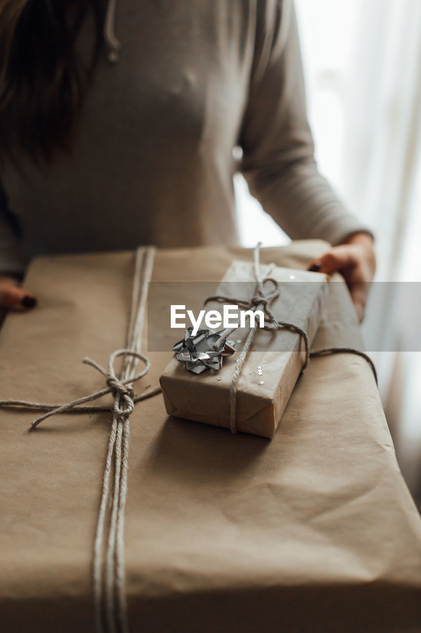 Close-up of woman holding christmas gift 