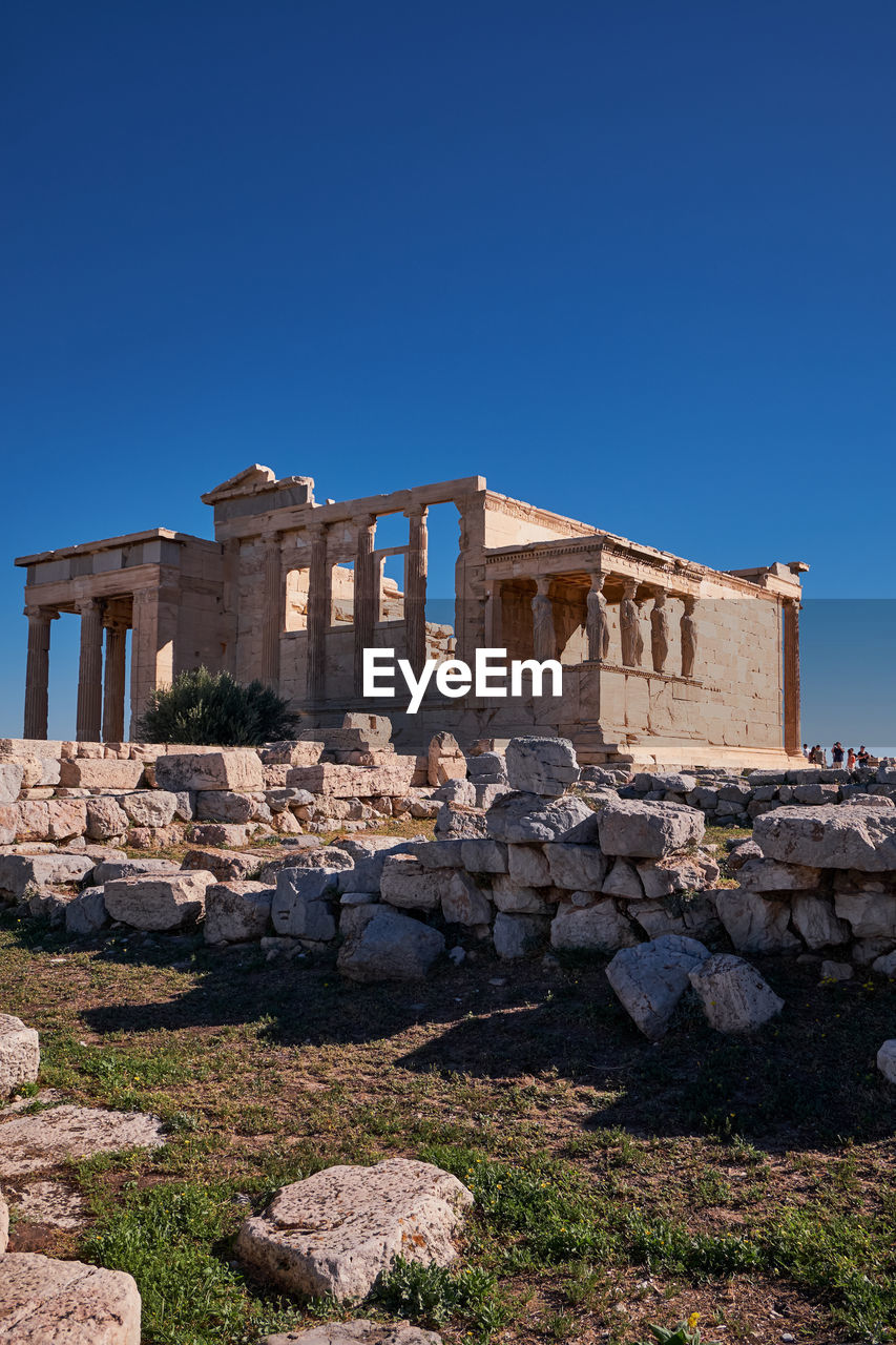 low angle view of historical building against clear blue sky
