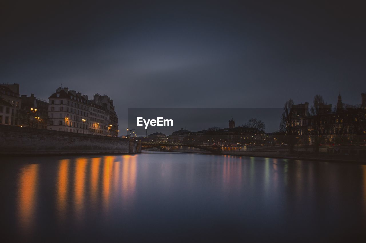 REFLECTION OF BUILDINGS IN RIVER