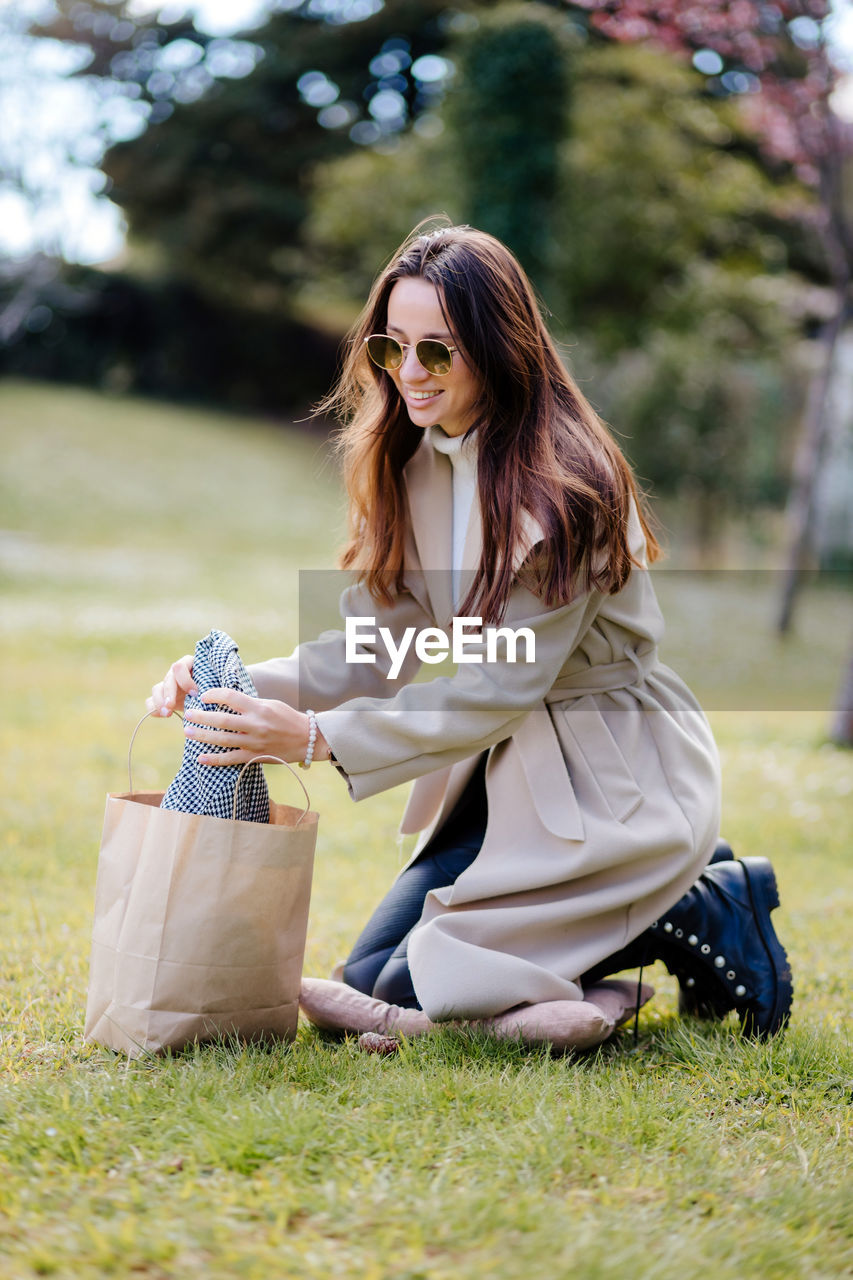 Woman wearing sunglasses on field